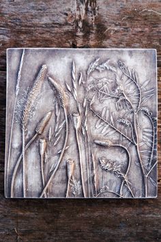 a metal plaque on top of a wooden table