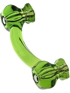 a green glass snake shaped object on a white background