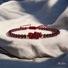 This red garnet dainty bracelet is fun and easy to wear and match with any outfit. They can express your style, mood, or personality in a subtle and charming way. It is perfect for anyone who loves minimalist style, natural stones. It is a unique and meaningful gift for yourself or someone special. You can wear it by itself or mix it with other bracelets for a fun and trendy look. If you have a large demand of the stone beads or bracelets, please feel free to contact us for details. - Material : Elegant Red Bracelets For Good Luck, Adjustable Burgundy Bracelet, Garnet Bangle Jewelry Gift, Garnet Bangle Jewelry As Gift, Elegant Hand-strung Bracelets For Good Luck, Elegant Red Beaded Friendship Bracelets, Handmade Burgundy Bracelets As Gift, Handmade Burgundy Bracelet As A Gift, Elegant Burgundy Bracelets As Gifts