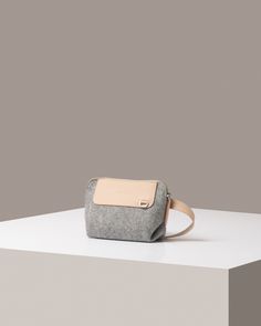 Compact yet versatile, the Bedford Merino Wool Belt Bag is crafted for modern hands-free convenience. Wear it around the waist or across the body for effortless access to essentials while on the move. With an adjustable strap and zippered main compartment, it’s perfect for days when you want to travel light without sacrificing style.

  

 Benefits of Merino Wool Felt

  
 *  Sustainable, biodegradable, and renewable  
 * Odor, stain, heat, and dirt-resistant 
 * Oeko-Tex® Certified 
 * See all Modern Crossbody Camera Bag For On-the-go, Modern Rectangular Pouch For On-the-go, Versatile Phone Bag With Cell Phone Pocket For On-the-go, Portable Pouch Bags For On-the-go, Multifunctional Pouch Travel Accessories For On-the-go, Versatile Belt Bag For On-the-go, Rectangular Travel Accessories With Removable Pouch For On-the-go, Multifunctional On-the-go Pouch Bag, Luxury Travel Mobile Phone Pouch