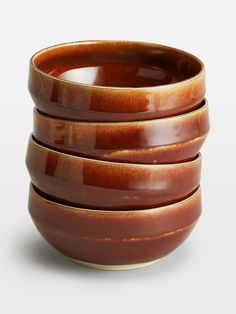 three brown bowls stacked on top of each other