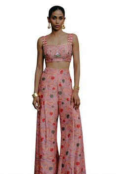 Pink padded crop top featuring aari, sequin, resham and zardozi hand embroidery with double strap shoulder. Paired with a kalamkari print palazzo pant. - Aza Fashions Summer Party Choli With Floral Print, Fitted Tops With Printed Motifs For Summer, Festive Sleeveless Crop Top For Summer, Festive Sleeveless Summer Crop Top, Chic Pink Festive Sets, Summer Party Sets With Printed Motifs, Chic Pink Festive Set, Party Fitted Choli With Printed Motifs, Spring Pink Sets With Unstitched Blouse