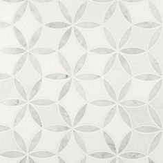 a white and grey tile with circles on it