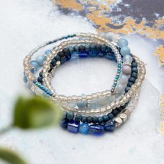 Elevate your corporate style with our Magical Blue Mix & Match Bracelet. This stackable sparkling blue theme set is perfect for the busy working woman, providing both elegance and comfort with its small gemstone beads. Bring the beauty of the stars to your everyday look. Elegant Blue Stackable Crystal Bracelet, Adjustable Blue Wrap Bracelet With Faceted Beads, Elegant Adjustable Blue Crystal Bracelet, Adjustable Blue Stackable Wrap Bracelet, Elegant Sapphire Bracelets With Faceted Beads, Elegant Sapphire Bracelet With Faceted Beads, Blue Gemstone Beads Stretch Bracelet, Blue Crystal Bracelet With Stackable Round Beads, Adjustable Blue Gemstone Beads Stretch Bracelet