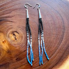 Blue Lagoon - Long Bead Drop Earrings Description: Brand New, Hand Made By Me. Beads Are A Combination Of Gunmetal Grey, Matte Clear, And Shades Of Blue Glass Seed Beads (Done In A Color Gradient) With Silver Tone Cone Caps On Top. Length: Just A Little Over 5 Inches Long From Top Of Hook To Bottom Of Last Bead. Let Me Know If You Have Any Questions. Tags: #Brickstitchearrings #Handmade #Lotusearrings #Longearrings #Seedbeadearrings Simple Bead Earrings, Dark Earrings, Long Beaded Earrings, Native Earrings, Beaded Projects, Bead Drop Earrings, Silver Star Earrings, Spider Earrings, Lotus Earrings