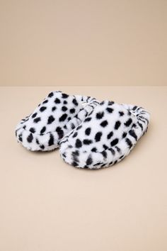 Slide through the day in maximum comfort (and style) thanks to the D'Amelio Footwear Socozee White and Black Spotted Faux Fur Flatform Slippers! Super soft and fuzzy faux fur boasts a black spotted pattern as it shapes the perfect slipper silhouette with a rounded toe upper and a slide-on design. Matching faux fur lines the interior for extra-cozy wear, while the chunky, flatform-inspired heel completes the look. Available in whole sizes only. 1. 75" wrapped heel. Cushioned insole. Felted rubber Casual Faux Fur Slippers For Winter, Casual Soft Faux Fur Slippers, Casual Faux Fur Slippers, Casual Faux Fur Lined Slippers, Winter Slippers With Faux Fur Lining For Loungewear, Casual Slippers With Faux Fur Lining For Spring, Winter Faux Fur Lined Slippers For Loungewear, Winter Loungewear Slippers With Faux Fur Lining, White Slippers For Winter Loungewear