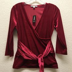 Express Faux Wrap Ribbed Tie Front 3/4 Sleeve Velvety Blouse Cranberry With Attached Belt Top By Express. Brand New With Tags. Approximate Measurements Pit To Pit: 17" Collar To Hem: 22" Chic Winter Tops With 3/4 Sleeves, Chic Red Top With 3/4 Sleeves, Red 3/4 Sleeve Tops For Work, Fall Party Top With 3/4 Sleeve, Fitted Blouse With 3/4 Sleeves For Fall, Burgundy Long Sleeve Tops For Night Out, Burgundy Tops For Date Night In Fall, Burgundy Blouse For Fall Night Out, Fitted Blouse With 3/4 Sleeves For Night Out