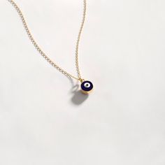 "This gorgeous evil eye necklace combines 14k solid gold with a simple evil eye pendant is the protective amulet you need. Choose the perfect birthday, an anniversary or just a random Friday to cherish your love. D E T A I L S * Made to Order. * 100% 14k Solid Gold * Choice of Gold Color: Yellow Gold, Rose Gold, White Gold * Pendant Height: 5 mm / 0.19 inch * Pendant Width: 5 mm / 0.19 inch * Length: 14\", 16\", 18\", 20\", 22\" (Got a little note that can help you in the photos.) * Ready to Shi Minimalist Blue Evil Eye Jewelry, Blue Minimalist Evil Eye Jewelry, 14k Gold Evil Eye Amulet Necklace, Minimalist Round Evil Eye Jewelry, 14k Gold Evil Eye Necklace With Round Pendant, 14k Gold Evil Eye Charm Necklace As Gift, Gold Plated Evil Eye Pendant Charm Necklace, Dainty 14k Gold Charm Necklace With Evil Eye, Minimalist Gold Evil Eye Jewelry