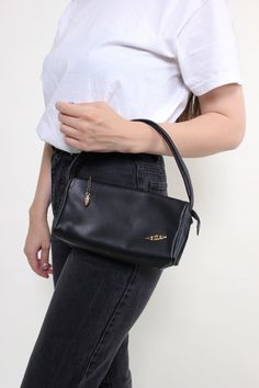 Hi! This is vintage from 90's Minimalist shoulder bag in black color with one zip closure.  If u need measurements of this vintage mini bag, please, feel free to ask me about the measurements. This item is vintage, so it can have some defects. Additional photos can be send We are glad that you are interested in lots that we sell. Wish you a good shopping! FOLLOW US : Instagram: https://www.instagram.com/olena_vintage Visit our ETSY shop - TARASCOMMON.ETSY.COM for more cool vintage finds. Retro Black Baguette Bag For Daily Use, Vintage Baguette Bag With Removable Pouch For Everyday, Vintage Everyday Baguette Bag, Vintage Everyday Handheld Baguette Bag, Vintage Handheld Baguette Bag For Everyday Use, Retro Rectangular Baguette Bag With Zipper Closure, Retro Rectangular Baguette Bag With Zipper, Vintage Everyday Shoulder Bag With Zipper Closure, Everyday Vintage Shoulder Bag With Zipper Closure