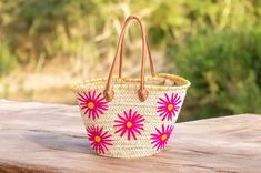 Discover the perfect blend of elegance and charm with our Handwoven Straw Bag featuring vibrant pink and yellow flower embroidery. Crafted from high-quality straw and adorned with genuine leather handles, this beautifully designed Floral Beach Tote is ideal for summer outings, market trips, or as a unique gift for someone special. A stunning bag designed to enhance your style. Straw Bag with Pink and Yellow Flower Embroidery - Floral Beach Tote with Leather Handles - Boho French Market Basket - Embroidery Beach, French Market Basket, Decorative Storage Baskets, Market Basket, French Market, Market Baskets, Straw Bags, Summer Bag, Market Tote