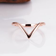 This gorgeous, timeless triangle curved band comes in your choice of sterling silver, 14k Rose Gold Vermeil or 14k Gold Vermeil.  Sold separately.   If you want a top and bottom, you will need to buy 2.  Gemstone engagement ring sold separately.  This listing is for the curved band only.   ✦ DETAILS ✦ ✧ Handcrafted  ✧ Sizes 3.75-11.25 ✧ Curved band only - Gemstone engagement ring sold separately ✧ This piece will arrive ready to gift in a Kherish Jewelry Pouch. ✧ Due to the nature of the handmad Formal Rose Gold Sterling Silver Stackable Rings, Minimalist Triangle Jewelry For Anniversary, Trillion Cut Rose Gold Jewelry Gift, Elegant Triangle Rings For Anniversary, Minimalist Trillion Cut Jewelry For Formal Occasions, Minimalist Trillion Cut Promise Ring, Formal Rose Gold Stackable Rings With Open Band, Elegant Rose Gold Trillion Cut Ring, Triangle Shaped Sterling Silver Jewelry For Anniversary