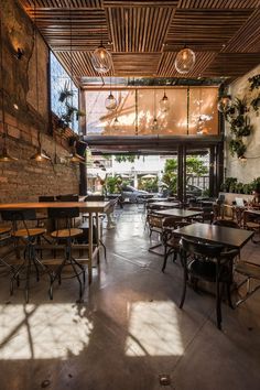 the inside of a restaurant with tables and chairs