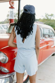 Indulge in ultimate comfort and style with our baby blue sleeveless T-shirt romper. The stretchy, relaxed fit allows for easy movement and lounging, while the rounded neckline adds a touch of elegance. Perfect for a day of relaxation or a casual outing, this romper is a must-have addition to your wardrobe! runs oversized with stretch model, Kennedi is 5'7" and wearing a size small Light Blue Sleeveless Jumpsuits And Rompers For Day Out, Summer Casual Tank Top For Lounging, Light Blue Sleeveless Tank Top For Loungewear, Casual Summer Tank Top For Lounging, Chic Sleeveless Top For Lounging, Chic Light Blue Sleeveless Jumpsuits And Rompers, Light Blue Sleeveless Jumpsuit For Loungewear, Light Blue Stretch Jumpsuits And Rompers For Summer, Sneaker Heels Wedges