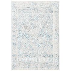 a blue and white rug with an intricate design on the bottom, in front of a white background