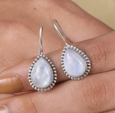 Moonstone Earring, Rainbow Moonstone Pear Earring, Vintage Moonstone Earring, Handmade Moonstone Earring, Moonstone Earring for Women DESCRIPTION :- Gemstone: Rainbow Moonstone Stone Size- 8X10 MM (Approx) *the stones may vary slightly in shape, size and color. (stone size can be customize on Demand) Weight :-  25 Cts. (approx) Our products are totally handmade and made with high quality gemstones and sterling silver. -If you believe in buying top quality products for yourself and for your famil Teardrop Moonstone Gemstone Earrings, Moonstone Teardrop Gemstone Earrings, Moonstone Teardrop Earrings With Natural Stones, Pear Earrings, Earring Handmade, Moonstone Stone, Earring For Women, Moonstone Earrings, Rainbow Moonstone