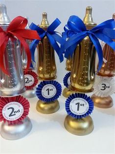 four small bottles with ribbons around them