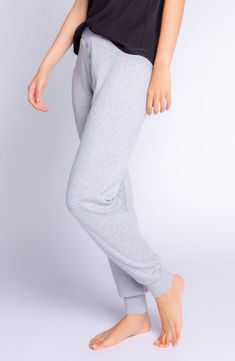 Slumber, lounge and take it easy in these ribbed joggers topped with a comfy elastic waist. 31" inseam; 7 1/2" leg opening; 9" front rise; 13 1/2" back rise (size Medium) 48% rayon, 47% polyamide, 5% elastane Machine wash, dry flat Imported Comfy Joggers With Elastic Cuffs For Leisure, Comfortable Leisure Joggers With Elastic Cuffs, Comfortable Joggers With Elastic Cuffs For Leisure, Comfortable Stretch Sweats With Elastic Waistband, Sporty Solid Ribbed Pants, Comfy Sweatpants With Ribbed Waistband For Relaxation, Comfortable Super Soft Pants, Comfy Joggers With Ribbed Waistband For Relaxation, Cozy Pants With Ribbed Cuffs For Relaxation