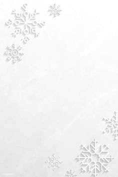 snowflakes on a white paper background with space for text or image in the center