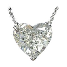 This 0.81ct heart shaped certified diamond offers a well executed shape, bright white D color, and a 100% eye clean appearance. Exceptionally well cut, this diamond displays fantastic brilliance! The diamond is certified by GIA, the world’s premier gemological authority. Under GIA’s rigorous standards, the diamond received a color grade of G, and it is bright white. Graded VS2 for clarity, the diamond is 100% eye clean. The inclusions are wispy, and they blend perfectly into the sparkle. The dia Heart Shaped Diamond Necklace, Heart Shaped Diamond Pendant, Heart Shaped Diamond Ring, Diamond Heart Pendant Necklace, Heart Shaped Pendant Necklace, Fancy Yellow Diamond, White Gold Chains, Diamond Necklaces, Heart Shaped Diamond