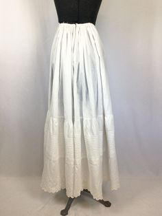 "Vintage Edwardian white cotton anglaise broderie underskirt Standard waist band with a single hook and eye in back for closure Flat front with heavy gathering at waist in back First ruffle is covered in on pintuck pleats Second large ruffle is of anglaise broderie This is beautiful and could be worn as a slip or even a skirt MEASUREMENTS: Fits like a XXS Waist: 22\" Hips: upto 46\" Length: 37\" Label/Brand: None Condition: Very Good * small spots on front (see pic) * small pin holes in front ne Pintuck Pleats, Petticoat Skirt, Skirt Measurements, 1920s Dress, Half Slip, Small Pin, Simply Lovely, White Eyelet, Vintage Yellow