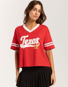 Rsq Texas V-Neck Tee. Graphic Screened On Front, And Two Stripes On The Sleeves Give It A Sporty Edge. Features A Ribbed V-Neckline And Relaxed Fit. 100% Cotton. Machine Wash. Imported. Model Is Wearing A Size Small. Model Measurements:height: 5'8" Bust: 34"waist: 25"hips: 37.5" Collegiate V-neck Top With Letter Print, College V-neck Graphic Print T-shirt, Sporty V-neck Top For College, Sporty Stretch V-neck Tops, Cotton V-neck Tops With Graphic Print, Stretch Summer Tops For College, Varsity Tops For College In Spring, Varsity Tops For College Spring Season, Spring Varsity Tops For College