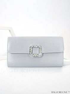 BagForLove - Silver Satin Evening Bag with Rhinestone Embellishments - Elegant Wedding Purse for Women Product Description Color Silver Details Rhinestone Magnetic Yes Strap Type Chain Pattern Type Plain Bag Size Small Type Square Bag Closure Type Flap Material Satin Composition 100% Polyester Size Chart INCH CM Bag Height Bag Length Bag Width Strap Length 5.1 inch 9.4 inch 2.2 inch 47.2 inch Bag Height Bag Length Bag Width Strap Length 13 cm 24 cm 5.5 cm 120 cm Details Pictures Similar Products h2 { text-align: center; } /* æ¢è¡ */ li{ white-space: normal; word-break: break-all; word-wrap: break-word; } .red-box { width: 100%; display: flex; flex-direction: row; flex-wrap: wrap; justify-content: center; } .red-box > div { width: 190px; height: 250px; margin: 10px; } .red-box > div > a > Elegant Silver Bag For Wedding Guest, Elegant Rectangular Bags For Prom, Elegant Rectangular Bag For Prom, Rectangular Rhinestone Bags For Prom, Elegant Silver Clutch For Prom, Silver Rectangular Clutch For Prom, Glamorous Silver Bag For Wedding Guest, Elegant Embellished Bags For Prom, Silver Rectangular Evening Bag For Prom