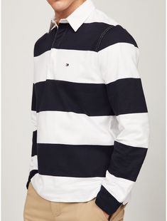 Tommy Hilfiger men's polo. Everything you love about our preppy rugby stripe polos in soft, cotton jersey and finished with a hidden button placket.  Material: 100% Cotton. White Cotton Polo Shirt With Horizontal Stripes, White Horizontal Stripe Cotton Polo Shirt, White Striped Cotton Polo Shirt, White Polo Shirt With Horizontal Stripes, Striped Preppy Polo Shirt, Preppy Striped Polo Shirt, White Polo Collar Top With Horizontal Stripes, Classic Tommy Hilfiger Striped Tops, Preppy White Polo Shirt With Striped Collar