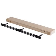 a wooden shelf with two black brackets on it