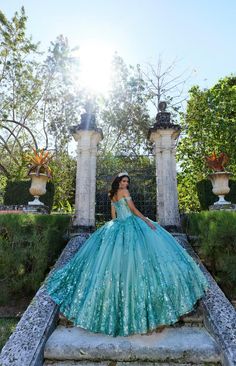 The fabric in this Princesa by Ariana Vara Quinceanera dress is Cracked Ice, Iridescent Sequin Tulle, Tulle, Stone Accents, Three-Dimensional Flowers, Pongee Lining. Detachable Off-the-Shoulder Drape, Cape, Detachable Train, Separate Full Bodice Liner, Earrings Included Teal Quince Dress, Aqua Quinceanera Dresses, Teal Quinceanera Dresses, Turquoise Quinceanera Dresses, Themed Prom Dresses, Quinceanera Dresses Blue, Disney Wedding Dresses, Fashion Illustration Sketches Dresses, Quince Dress