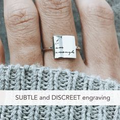 Sterling Silver I Am Enough Statement Ring Have faith in yourself! This subtle, discreet message reminds you that no matter what others say, just remember: 'I AM ENOUGH'. ✅ PRODUCT DETAILS * Material: solid sterling silver. * Square size is 10 x 10 mm and 1.3mm thick. * We use US ring size (please refer to the last picture of the product for the instruction to find your correct US size). ✅ PRODUCTION & SHIPPING INFO 📌 Important: please be aware that the shipping time does not include the pr Meaningful Promise Ring With Engraving Option, Meaningful Engraved Promise Ring With Engraving Option, Meaningful Engraved Ring For Promise, Meaningful Stamped Engraved Promise Ring, Meaningful Sterling Silver Promise Ring, Meaningful Sterling Silver Promise Ring Engraved, Meaningful Engraved Sterling Silver Promise Ring, Minimalist Engraved Ring For Promise On Mother's Day, Minimalist Engraved Promise Ring For Mother's Day