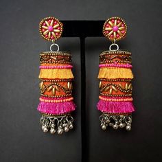 Fun and playful Afghani fringe earrings, with gold tone bead work. The perfect summer earring, colorful and carefree. Fabric backed ear stud ensures a comfortable fit. The main body is fabric wrapped around a metal cylinder. Beautiful vibrant colors. Little bells make a lovely sound when you move your head. Weight 21 gm. Find even more great earrings here: https://www.etsy.com/shop/boutiquebymaryam?section_id=22797814 Be sure to visit the rest of my shop here: https://www.etsy.com/shop/boutiqueb Ghungroo Jewellery, Bellydance Jewelry, Afghani Jewelry, Fabric Necklaces, Silk Thread Earrings, Metal Cylinder, Oxidised Silver Jewelry, Belly Dance Jewelry, Fabric Jewellery