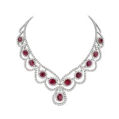 This statement necklace features 46.25 carats of F-H VS-SI pear and round brilliant diamonds, and 42.23 carats of cushion mixed cut red moderately strong rubies set in 18K white and yellow gold. This intricate piece features 23 pear brilliant diamonds and 425 round brilliant diamonds. Made in Italy. Viewings available in our NYC showroom by appointment. Luxury Ruby Necklace In White Gold, Luxury White Gold Ruby Necklace, Luxury White Ruby Necklace, Luxury Diamond White Ruby Bridal Necklace, Luxury Yellow Gold Ruby Bridal Necklace, Latest Necklace Design, Necklaces Luxury, Ruby And Diamond Necklace, Necklace White Gold