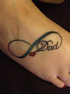 a foot tattoo with the word dad on it