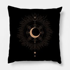 a black pillow with a gold crescent and stars on the front, against a white background