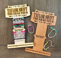 several different bracelets are on display next to each other, including one for taylor swift the eras tour