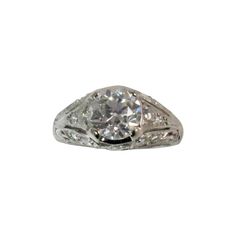 Vintage Platinum Ring, prong set with one European cut diamond, weighing 1.25cts, GIA certified (lab report #1182914479) F color, SI2 clarity and 14 bead set, full cut round diamonds weighing .47cts, F color, VS clarity Finger size 5, may be sized Classic Formal Jewelry With Diamond Accents, Classic White Gold Jewelry With Prong Setting, Classic Diamond White Cubic Zirconia Jewelry, Platinum Jewelry In Brilliant Cut Diamond White, Timeless Platinum Jewelry With Prong Setting, Platinum Jewelry With Brilliant Cut In Diamond White, Platinum Jewelry With Brilliant Cut Diamond White, White 14k Gold Jewelry With Brilliant Cut, White Gold Jewelry With Brilliant Round Cut