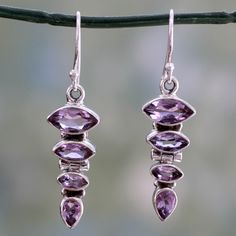 Amethysts align in dazzling tiers in these dangle earrings from Shanker of India. Three marquise-cut gemstones rest atop a pear-shaped amethyst all set in gleaming sterling silver. The amethyst gems total over 4 carats..925 Sterling silver Wedding Jewelery, Amethyst Gem, Ear Rings, Fancy Jewelry, Floral Jewellery, Jewelry Packaging, Hook Earrings, Pearl Ring, Jewelry Gift Box