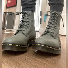 These Are Brand New, Unisex And More Of An Olive Green Imo! Very Cute And Very Comfortable. The Ankle Of This Boot Is So Soft And Form-Fitting. Details Our Classic 1460 8-Eye Boot Reconstructed From Carrara, A Veg Tan Leather Which Is Left Untreated To Highlight The Creases, Marks And Lines Unique To Each Wearer. A Record Of Every Journey, Night Out And Event. Set On Our Traditional Bouncing Air Sole And Secured With A Yellow Goodyear Welt Stitch. Completed With Antique Gold Eyelets And Tonal La Casual Fitted Combat Ankle Boots, Casual Green Leather Martin Boots, Green Casual Combat Boots With Round Toe, Casual Green Combat Boots With Round Toe, Leather Lace Up Boots, Veg Tan Leather, Goodyear Welt, Moto Boots, Leather Lace