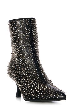 Polished studs create an edgy aesthetic on a bold bootie balanced by a pointy toe and tapered flare heel. Side zip closure Synthetic upper, lining and sole Imported Asian & Pacific Islander Owned/Founded Trendy High Heel Boots With Rivets, Fall High Heel Boots With Rivets, Fall Heeled Boots With Rivets, Punk Heeled Boots With Studs For Fall, Punk Studs Heeled Boots For Fall, Punk Style Studded Heeled Boots For Fall, Punk Stud Heeled Boots For Fall, Edgy High Ankle Boots With Studs, Edgy Studded Pointed-toe Boots