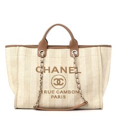 This is an authentic CHANEL Mixed Fibers Striped Medium Deauville Tote in Beige. This lovely woven tote is crafted of fine raffia with an iconic Chanel logo in brown. The bag features canvas threaded gold chain shoulder straps, brown leather handles, canvas trim, and an open-top. The brown fabric interior features zipper and patch pockets. Designer Brown Bags With Embroidered Logo, Chanel Tote Bag, Green Tote Bag, Green Tote, Chanel Tote, Chanel Shoulder Bag, Chanel Logo, Chanel Paris, Brown Fabric