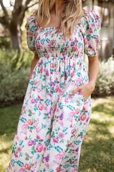 Fall in love with our Remy Cotton Dress! Featuring a stretchy smocked bodice, neckline, and puffed sleeves for ultimate comfort and versatility. This 100% cotton, fully lined dress is maternity friendly and has this fun, vibrant floral print along with pockets! Perfect for any occasion, the Remy will become one of your favorites in your closet to wear on repeat! Malibu Collection FIT Easy True to Size Fit Stretchy Bodice Flowy Pockets Lined Savannah is 5'8 Wearing Size Small Britt is 5'9 Wearing Maternity Dress With Smocked Bodice And Square Neck, Summer Maternity Midi Dress With Smocked Back, Maternity Square Neck Dress For Spring, Spring Garden Party Puff Sleeve Dress With Smocked Back, Empire Waist Puff Sleeve Dress For Brunch, Spring Empire Waist Puff Sleeve Dress With Smocked Back, Spring Puff Sleeve Empire Waist Dress With Smocked Back, Midi-length Puff Sleeve Dress For Garden Party, Midi Length Puff Sleeve Dress For Garden Party