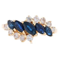 Size: 6 1/4 Sizing Fee: Up 2 sizes for $35 or Down 1 size for $30 Metal Content: 14k Yellow Gold Stone Information Natural Sapphires Treatment: Heating Carat(s): 1.09ctw Cut: Marquise Color: Blue Natural Diamonds Carat(s): .38ctw Cut: Round Brilliant Color: K - L Clarity: SI1 - SI2 Total Carats: 1.47ctw Style: Five-Stone with Accents Bypass Features: Tiered Silhouette Measurements Face Height (north to south): 3/8" (9.4mm) Rise Above Finger: 5/16" (7.5mm) Weight: 3.8 Grams Stamps: 14kp, maker's Heirloom Rings, Bypass Ring, Three Rings, Rise Above, La Face, Gold Stone, Ruby Ring, Natural Sapphire, Diamond Sizes