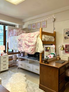 a loft bed sitting above a desk in a bedroom