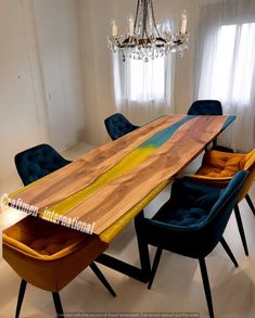 a wooden table with blue chairs around it