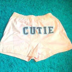 Brand New Pink Shorts With Cutie On The Back Shorts With Words On Back, Trendy Letter Print Shorts For Spring, Cute Loungewear Shorts For Spring, Cute Spring Pajama Shorts, Cute Stretch Bottoms Of Short Length, Trendy Short Bottoms With Letter Print, Cute Cotton Bottoms With Letter Print, Short Bottoms With Letter Print For Spring, Trendy Summer Bottoms With Letter Print