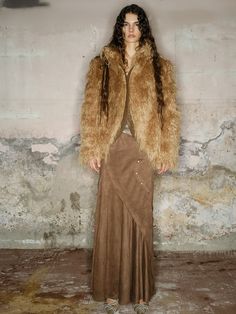 Oversized, dramatic coat in luxurious shaggy faux fur. Available in warm camel or edgy black with leather-look accents. Features exaggerated collar and voluminous silhouette for bold impact. Perfect for high-fashion events or as a showstopping addition to street style. Fall Long Coat With Feather Trim, Long Feather Trim Coat For Fall, Long Coat With Feather Trim For Fall, Brown Faux Fur Coat With Feather Trim, Fall Faux Fur Outerwear With Feather Trim, Brown Long Sleeve Fur Coat With Feather Trim, Brown Fur Coat With Feather Trim, Brown Faux Fur Outerwear With Feather Trim, Brown Faux Fur Long Coat