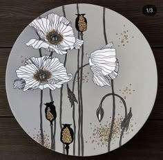 a plate with white flowers painted on it