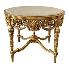 This center table is the perfect piece to add glitz, glam and luxury to an entryway. The gold finish on this piece is beautifully paired with a beige marble top that adds the perfect touch of elegance.   This table features an intricate floral beauty of baroque carvings and delicate curved legs.  Dimension: 31.5"H x 42.5" Diameter. Table Gogogne, Baroque Dining Table, Coffee Table Wedding, Baroque Interior Design, Fancy Furniture, Baroque Interior, Candy Pastel, Deco Baroque, Marble Round Coffee Table