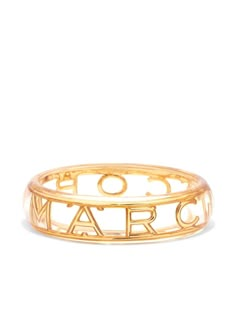 monogram logo bangle from Marc Jacobs featuring gold-tone, brass, monogram pattern, slip-on style and wide band. | Marc Jacobs Monogram Logo Bangle Marc Jacobs Ring, Marc Jacobs Bracelet, Marc Jacobs Jewelry, Preppy Jewelry, Jewelry Accessories Ideas, Monogram Pattern, Jewelry Lookbook, Girly Jewelry, Jewelry Inspo