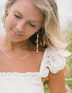 Turn heads with these jaw dropping Millie Pearl Earrings. Four pairs of delicate freshwater pearls hang from 14K Gold Filled hoops, creating a one-of-a-kind look you'll fall in love with again and again. 15mm 14k Gold-Filled hoops Eight 8mm freshwater pearls (per earring) linked together with 14K Gold Wire Handcrafted with love from San Clemente, California